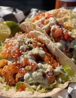 Tacos Suaves (Soft Tacos) Two Soft Shell Tacos with Pico De Gallo, Shredded Lettuce, Queso Fresco and Creamy Green Salsa with Choice of 1 Protein: Grilled Chicken, Jerk Chicken, Shredded Pork Barbacoa, or Tofu Cuns $10 Carne Asada, or Al Pastor Shrimp $13