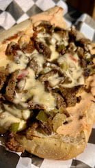 Chipotle Cheesesteak Your Choice of Carne Asada OR Grilled Chicken, Grilled Onions « Peppers, Monterey Jack and Queso Cheeses, and our Epic Chipotie Sauce on an Authentic Philly Roll $12